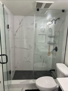 Bathroom Remodeling by Star Inspiration Home Renovation. New 3-piece bathroom addition featuring luxury 2x2 porcelain tiling on the floor and shower walls, a custom mosaic shower base.